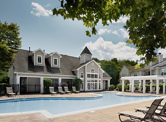 Hayworth Wilton’s expansive pool deck with lounge seating and pergolas