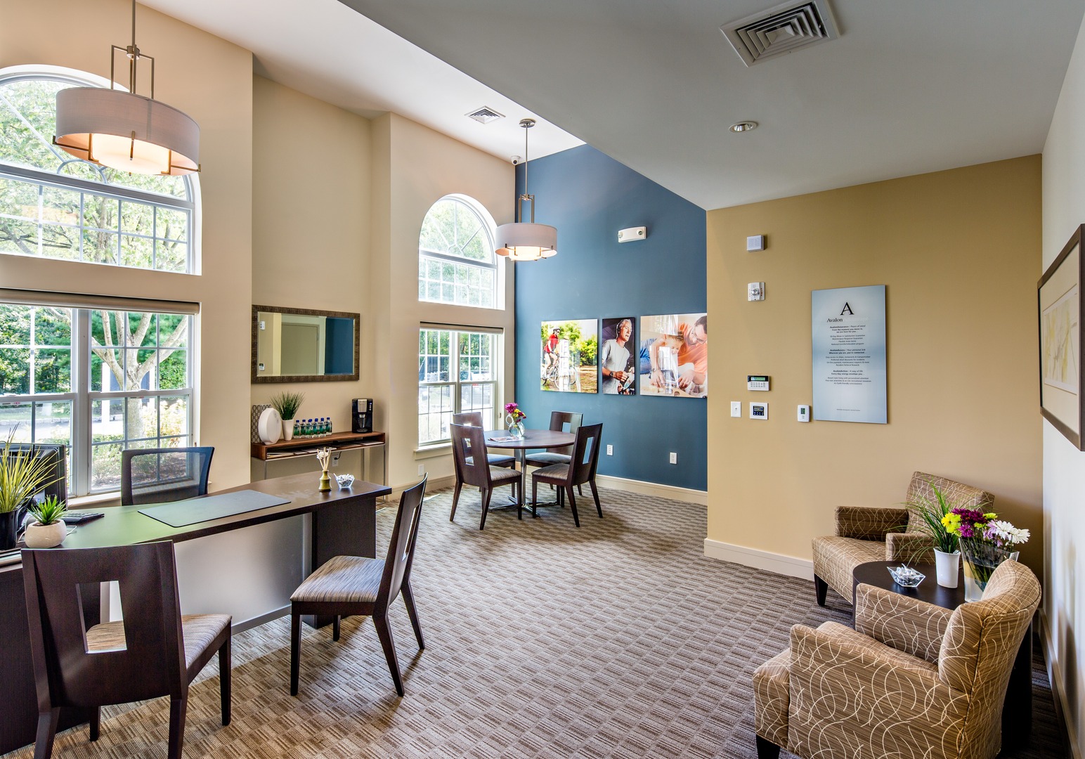 Resident lounge with seating and tables.